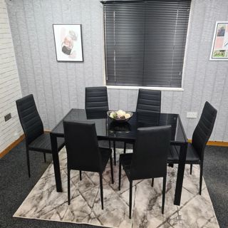 Enhancing Your Cosy Home with a Wooden Dining Table and Black Dining Chairs