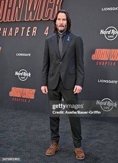 Actor, Keanu reeves delves into auto racing at the Indianapolis motor speedway.