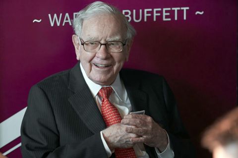 Warren Buffett’s firm reports $12.8 billion loss as investments fall but its insurers performed well